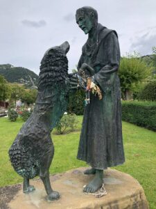 St Francis and the Wolf statue next to Santa Maria della Vittoria in Gubbio